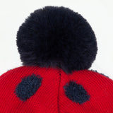 Red polka dot hat with pompom