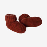 Newborn knit booties in terracota